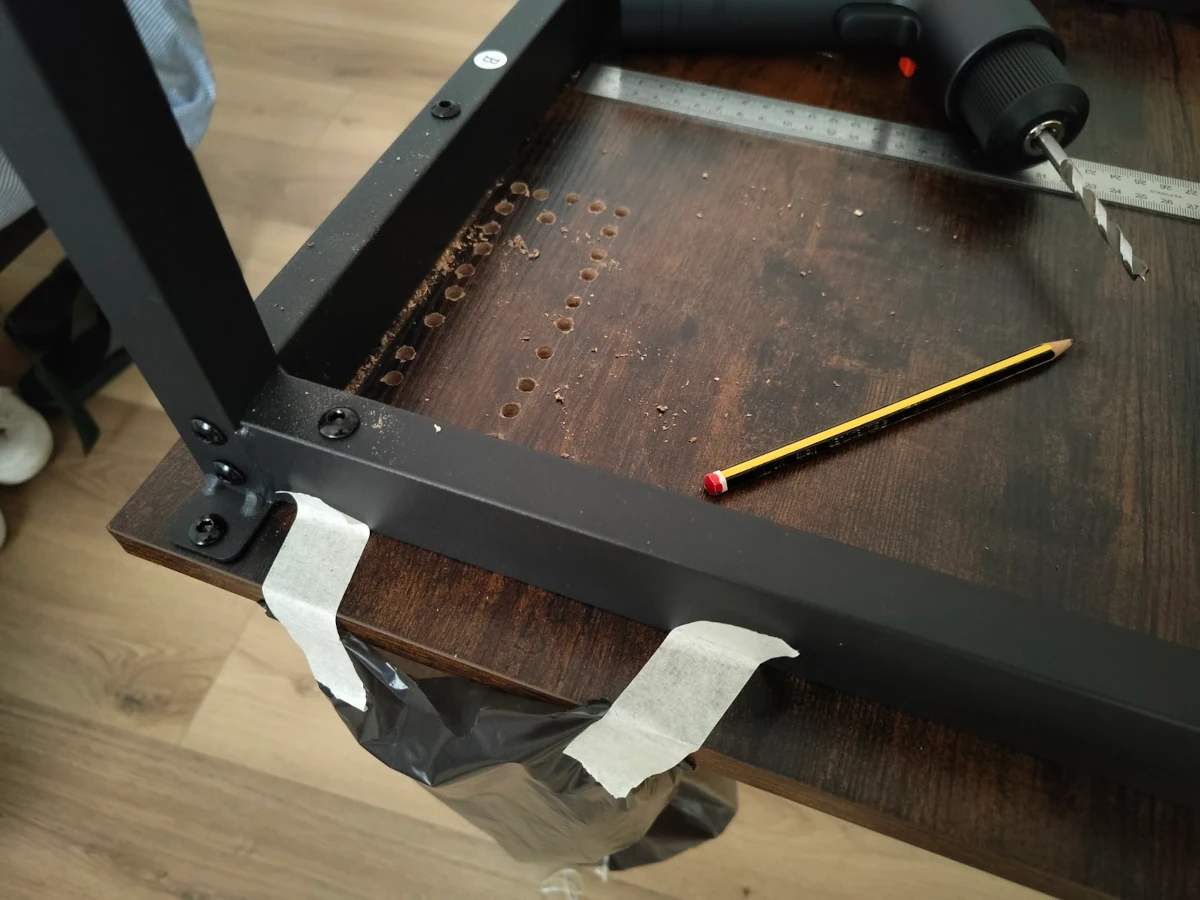 Mounting the worktop's power outlet required a bunch of drilling.
